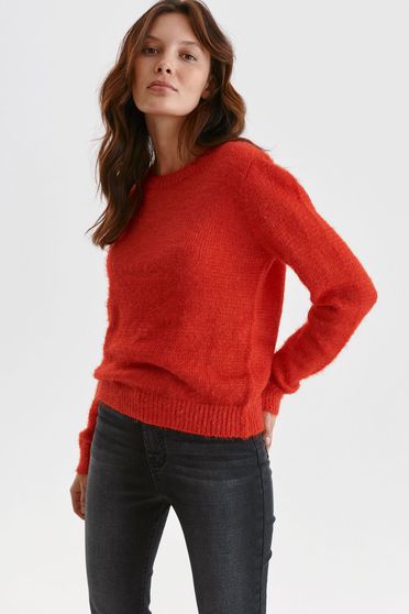 Red sweater knitted from fluffy fabric loose fit with rounded cleavage