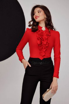 Red women`s shirt cotton tented with ruffle details accessorized with breastpin
