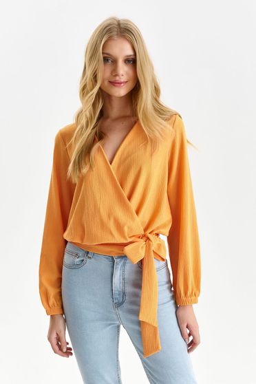 Orange women`s blouse loose fit from striped fabric wrap around