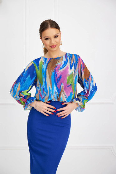 Women`s blouse from veil fabric loose fit with puffed sleeves