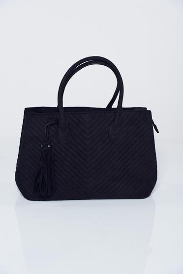 Black bag with tassels seams inside the fabric