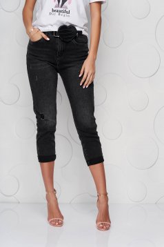 Black jeans accessorized with belt small rupture of material casual