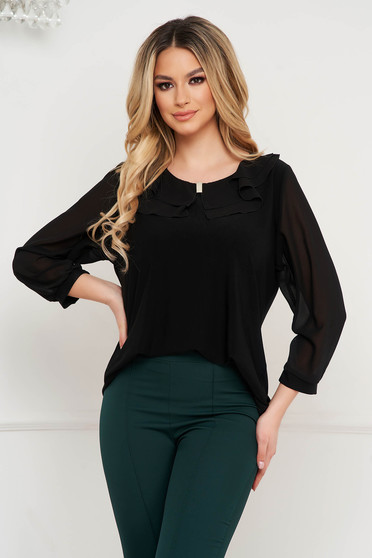 Black women`s blouse from elastic and fine fabric with ruffles on the chest occasional