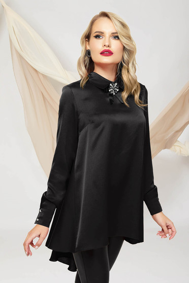 Black women`s blouse asymmetrical loose fit from satin accessorized with breastpin